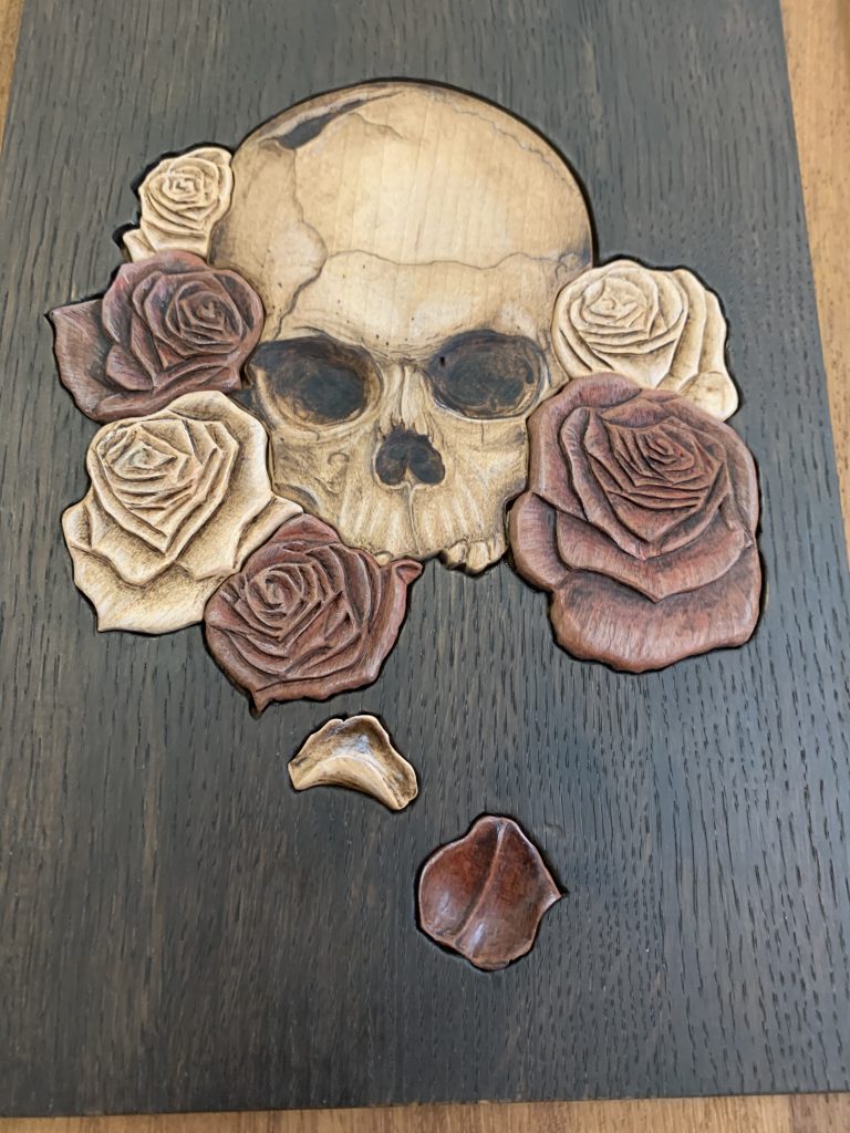 Unique skull and rose pyrography wood burning picture store plaque.